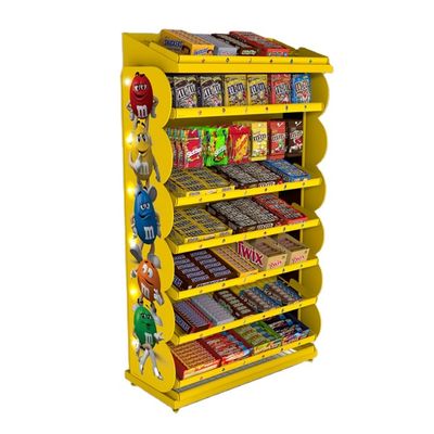 Os pontos de venda personalizados indicam a cremalheira de exposição dos doces com bandejas ajustáveis